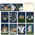 Collection of religious nativity greeting cards featuring diverse scenes like the manger, angels, and wise men, with a blank envelope.