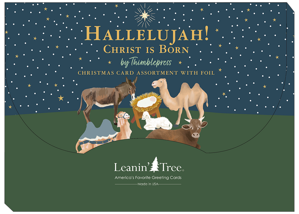Back packaging of a religious card assortment featuring a manger scene with animals, star of Bethlehem, and text 'Hallelujah! Christ is Born' by Leanin' Tree.