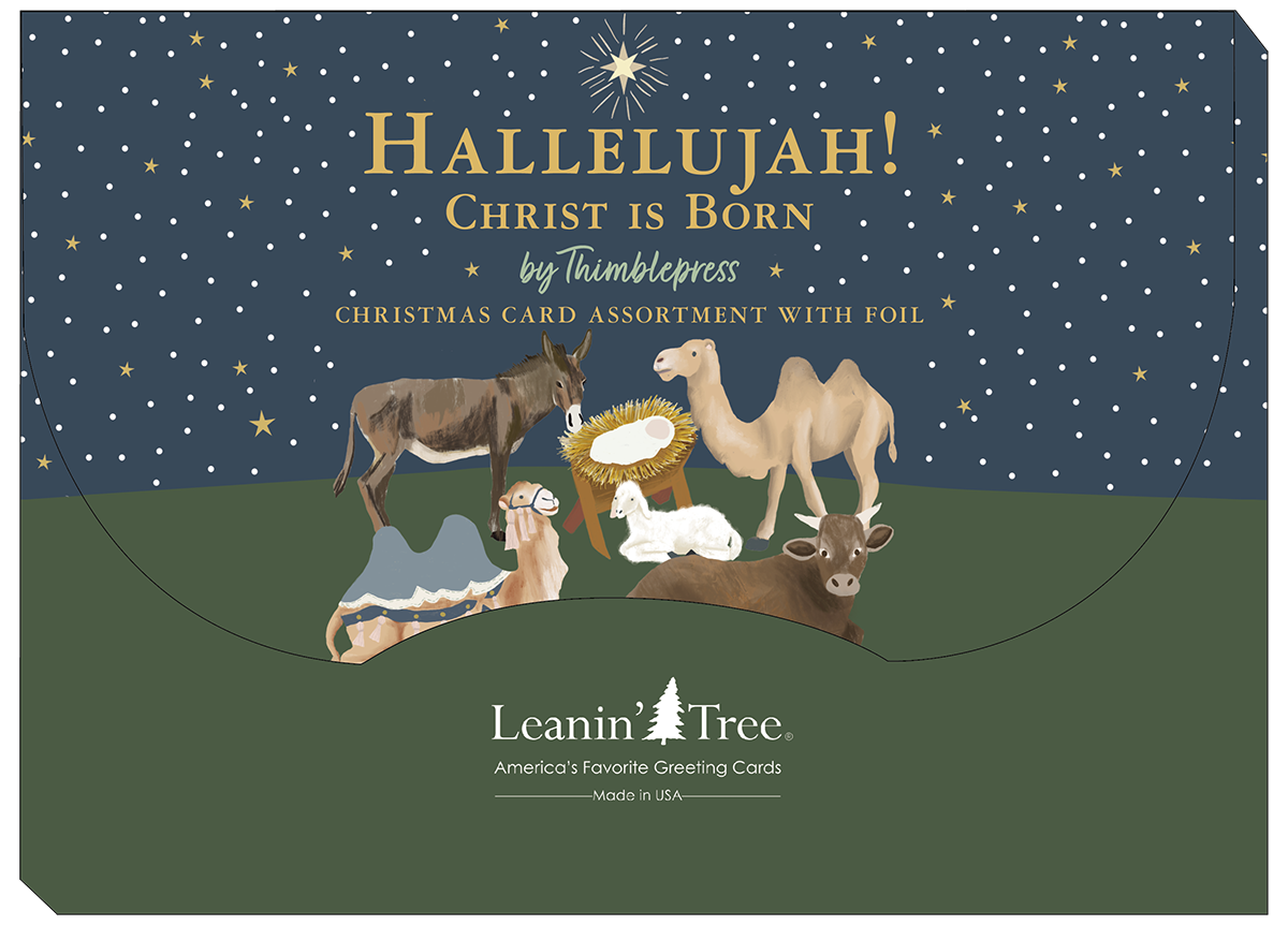 Back packaging of a religious card assortment featuring a manger scene with animals, star of Bethlehem, and text 'Hallelujah! Christ is Born' by Leanin' Tree.