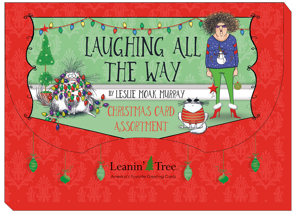 Cover of the 'Laughing All The Way' Christmas Card Assortment box by Leslie Moak Murray from Leanin' Tree, featuring whimsical characters and festive lights on a red and green background.