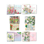 Variety of open watercolor greeting cards with messages for 'Happy Anniversary,' 'Many Thanks,' 'Sympathy,' and 'Congratulations,' featuring elegant floral artwork.