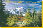 The front cover of 'The Pacific Northwest by Art Wolfe Blank Card Assortment' box, featuring a majestic snow-capped mountain, a serene lake, and tall evergreen trees under a blue sky.