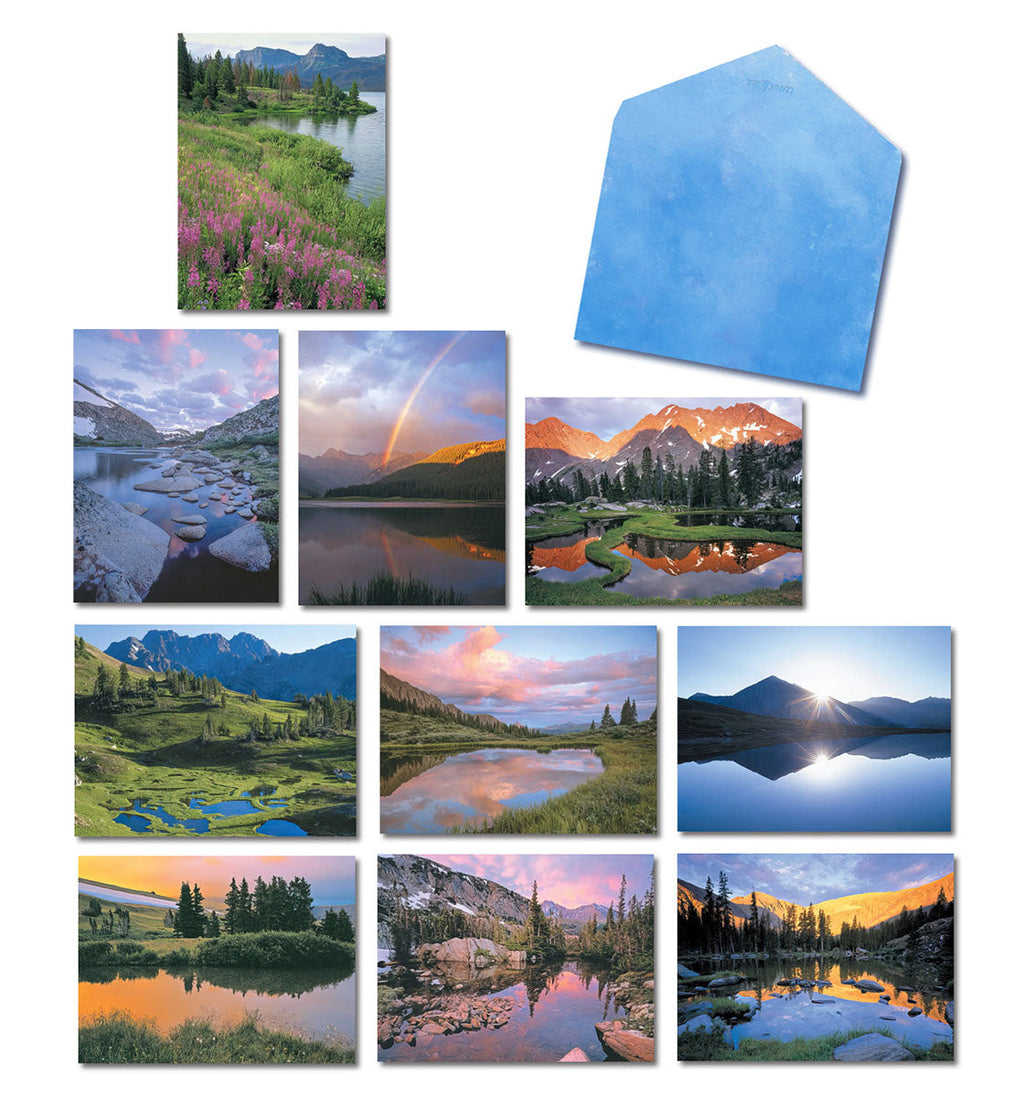Assortment of blank greeting cards featuring various high country lake and mountain landscapes, with a blue envelope. Includes images of vibrant sunsets, reflective waters, and lush alpine scenery.