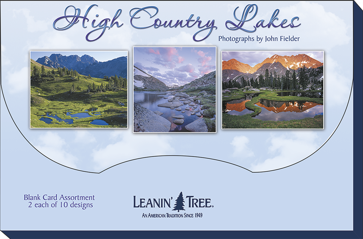 Packaging for "High Country Lakes" blank card assortment by Leanin' Tree. Shows three sample cards with mountain and lake photography, highlighting the 2 each of 10 designs.