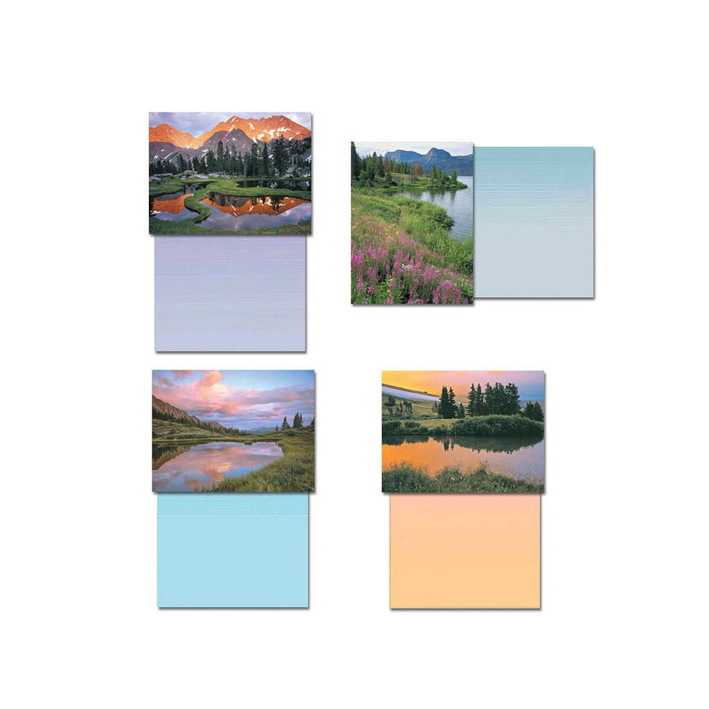 Four blank greeting cards from the assortment, each displaying a unique high country lake and mountain scene with its corresponding blank interior. Images include a vibrant sunset reflection and a serene green landscape.