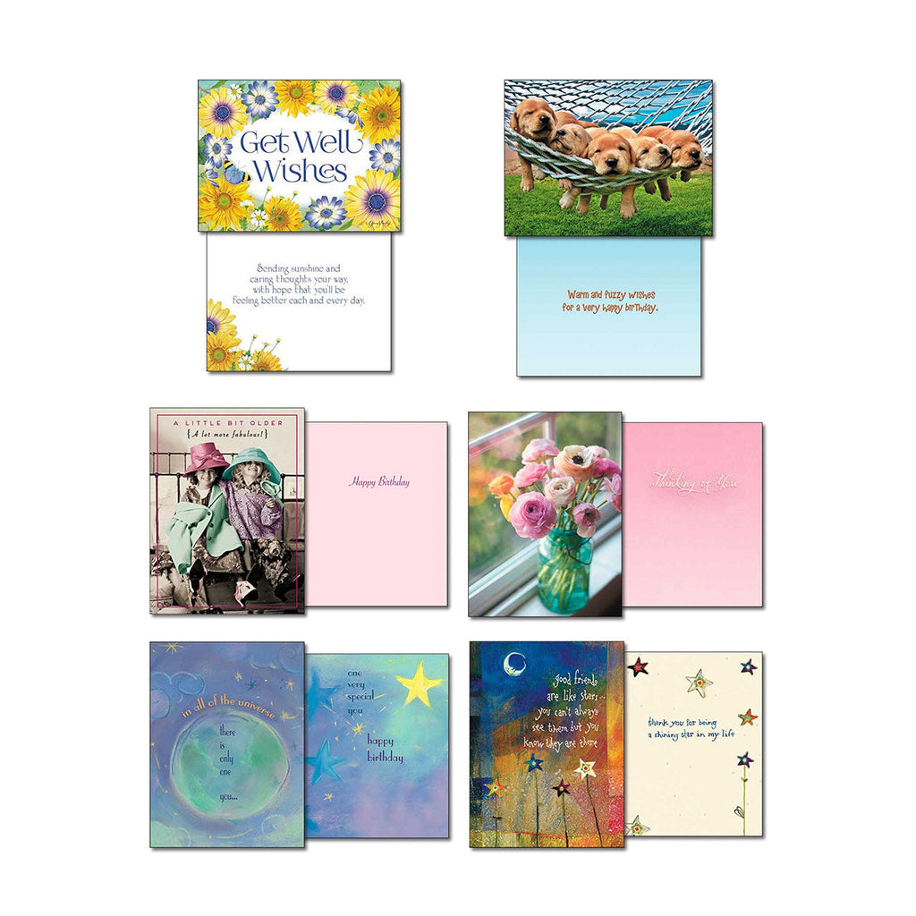 Variety of Leanin' Tree cards open to show front and inside messages: 'Get Well Wishes' sunflowers, puppies in a hammock, 'A Little Bit Older' ladies, pink flowers in a vase, celestial 'one of the universe' card, and 'Good Friends' stars.
