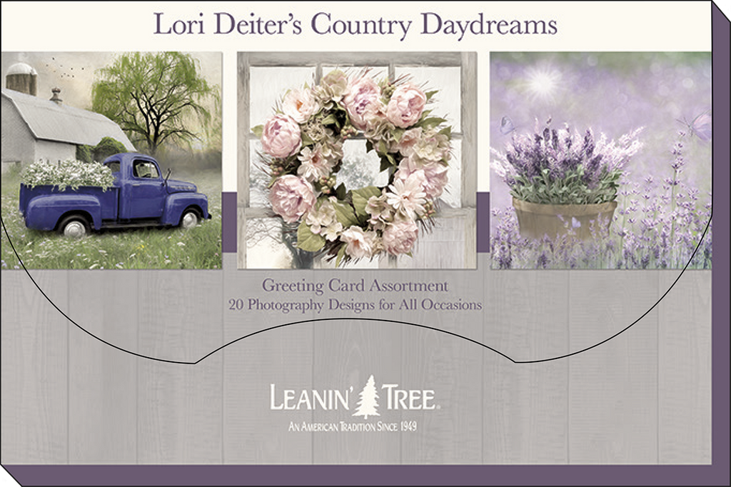 Product packaging for Lori Deiter's Country Daydreams greeting card assortment by Leanin' Tree, showcasing three card designs: a blue truck by a barn, a floral wreath, and a potted lavender plant.