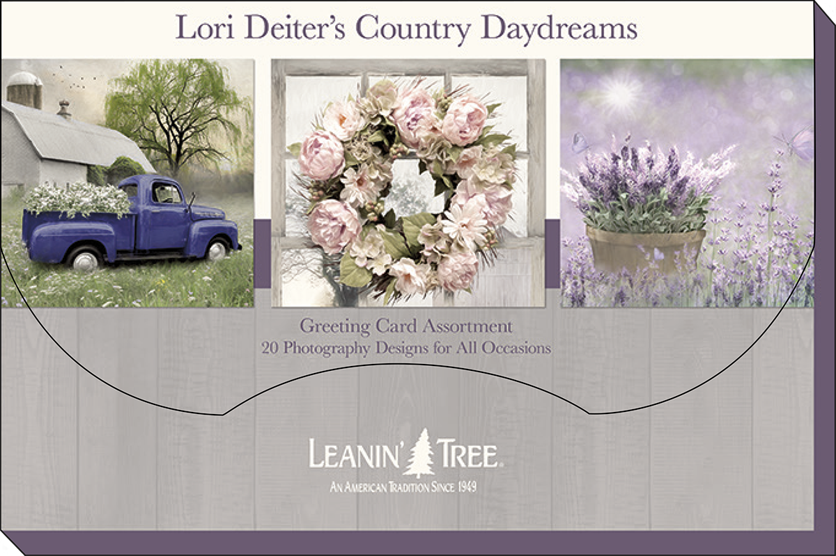Product packaging for Lori Deiter's Country Daydreams greeting card assortment by Leanin' Tree, showcasing three card designs: a blue truck by a barn, a floral wreath, and a potted lavender plant.