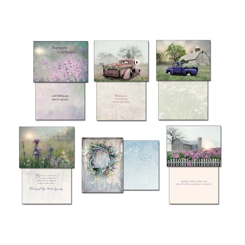 Layout of nine diverse greeting cards from the assortment, revealing their front imagery and accompanying interior sentiments, featuring lavender fields, old trucks, barns, iris flowers, and a floral wreath.
