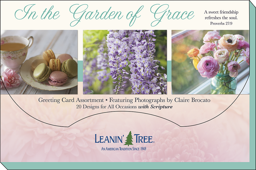 Leanin' Tree 'In the Garden of Grace' greeting card assortment banner, showcasing 20 floral designs with scripture, featuring macarons, wisteria, and ranunculus by Claire Brocato.