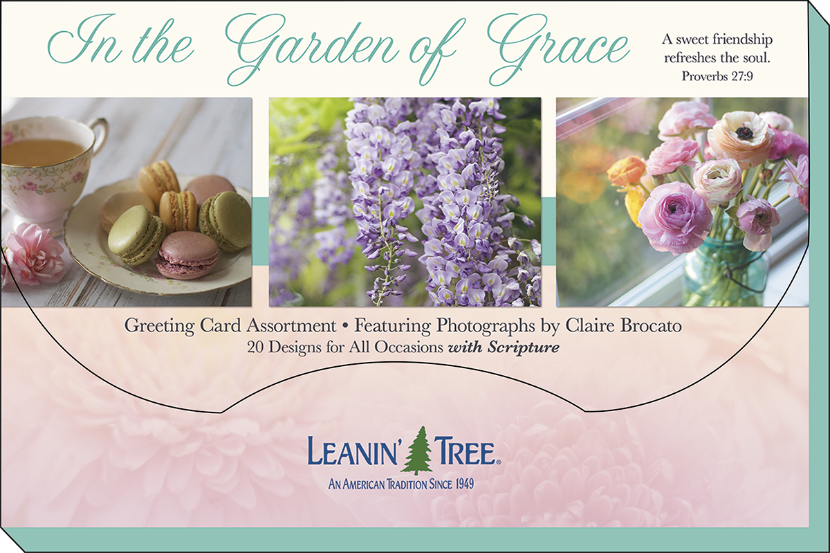 Leanin' Tree 'In the Garden of Grace' greeting card assortment banner, showcasing 20 floral designs with scripture, featuring macarons, wisteria, and ranunculus by Claire Brocato.