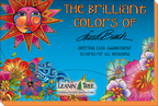 Laurel Burch Leanin' Tree greeting card assortment box top, featuring a radiant sun, colorful flowers, and text "The Brilliant Colors of Laurel Burch" and "Greeting Card Assortment 20 Cards for All Occasions."