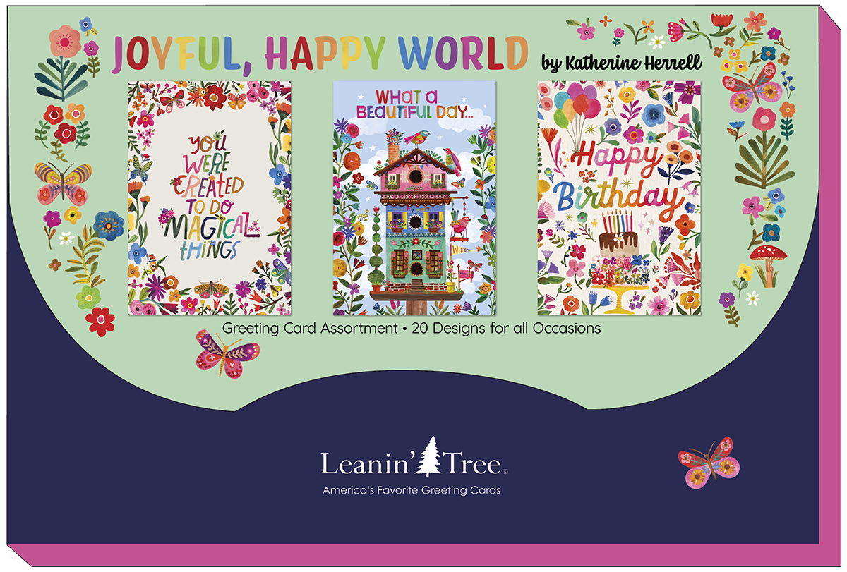 Packaging for the 'Joyful, Happy World' Leanin' Tree greeting card assortment by Katherine Hernell, showcasing three distinct card designs with floral and butterfly motifs, and the brand tagline 'America's Favorite Greeting Cards'.