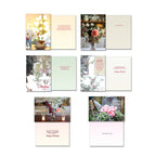 Collection of Leanin' Tree greeting cards showing front and inside designs: 'Thinking of You' with bokeh lights, 'Let us be grateful' with a snowy scene, 'Thank You' with a floral arrangement, 'Happy Birthday' with blooming flowers, 'Thinking of You' with lit candles, and 'Thinking of You' with roses in a watering can, highlighting emotional versatility.