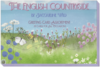 Packaging for 'The English Countryside Greeting Card Assortment' by Jacqueline Wild. The design features an idyllic field of purple and white wildflowers, with a white butterfly in the foreground, evoking a serene rural landscape.