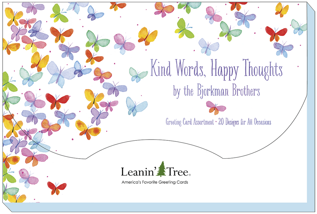 Close-up of the 'Kind Words, Happy Thoughts by the Bjorkman Brothers' greeting card assortment packaging, featuring a butterfly design and text '20 Designs for All Occasions' from Leanin' Tree.