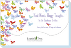 Close-up of the 'Kind Words, Happy Thoughts by the Bjorkman Brothers' greeting card assortment packaging, featuring a butterfly design and text '20 Designs for All Occasions' from Leanin' Tree.