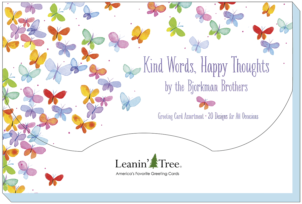 Close-up of the 'Kind Words, Happy Thoughts by the Bjorkman Brothers' greeting card assortment packaging, featuring a butterfly design and text '20 Designs for All Occasions' from Leanin' Tree.