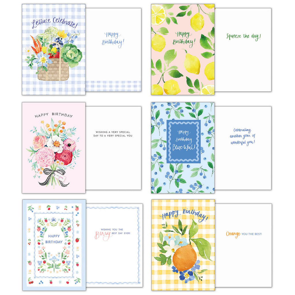 Arrangement of ten open greeting cards from the assortment, displaying both front designs and inside messages. Includes 'Lettuce Celebrate,' 'Happy Birthday' with lemons, floral 'Happy Birthday,' and 'Happy Birthday Blue-tiful' cards.