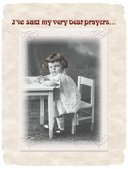 Vintage black and white photo on an encouragement greeting card showing a solemn young girl with curly hair sitting at a small table, hands clasped, with text 'I've said my very best prayers...' for spiritual support and comfort.