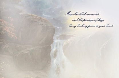 The inside of a sympathy card, featuring a soft, misty waterfall background with the message: 'May cherished memories... bring healing peace to your heart.'