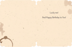 Inside of a rustic-themed birthday greeting card with coffee stain designs. Text says: 'Lucky me! And Happy Birthday to You!' showing space for a personal message.