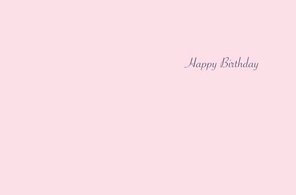 Inside of a light pink birthday card with the words 'Happy Birthday' in purple script.
