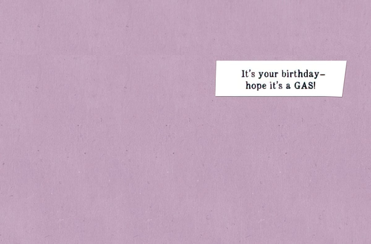 Inside of a humorous greeting card with a simple message on a white rectangular strip: 'It's your birthday - hope it's a GAS!' on a light purple background.