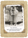 Vintage sepia-toned funny birthday card for a female friend, featuring two elderly women smiling beside a classic car. The text reads: 'You and me... We're gonna be friends until we're old and senile!'