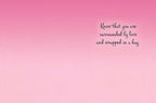 Inside of the encouragement greeting card with a soft pink gradient background and black cursive text on the right side reading "Know that you are surrounded by love and wrapped in a hug.".