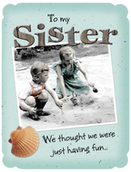 Heartfelt sister birthday card featuring vintage photo of two young girls playing in sand, nostalgic 'To my Sister' message, seashell accent.