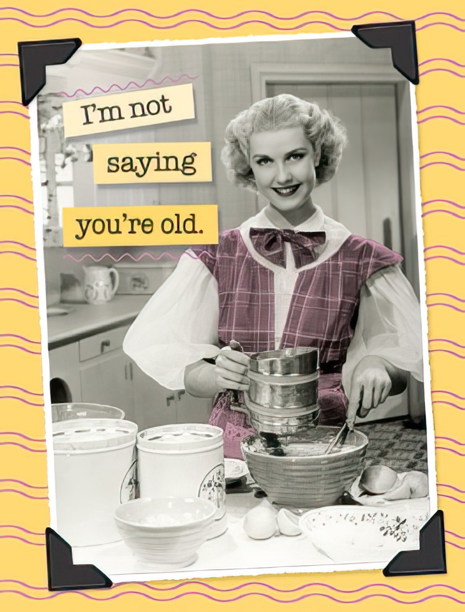 Funny greeting card front featuring a smiling retro woman sifting flour, with text 'I'm not saying you're old.' on a yellow background with wavy lines and black photo corners. Perfect for a humorous birthday message.