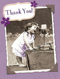 Cute thank you card for parents featuring a sepia-toned photo of a joyful child speaking into a vintage telephone, framed with purple flowers and 'Thank You!' text.