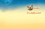 Interior of a charming greeting card with a light blue and yellow gradient background, featuring a smiling dog in a vampire costume and the playful text 'Smile... It's Halloween!' in red script. Blank space for a personalized message.