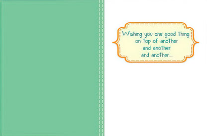 Inside of the birthday card with a green border and text bubble wishing 'one good thing on top of another and another'.