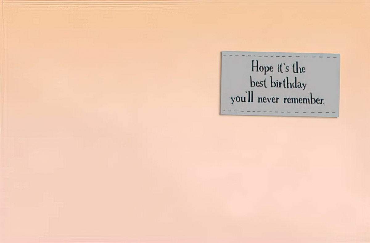 Inside a humorous birthday greeting card displaying the message 'Hope it's the best birthday you'll never remember' on a light peach background.