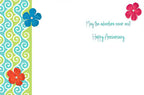 Inside of a lighthearted anniversary card with the message 'May the adventure never end! Happy Anniversary' in a playful script. The left border features a blue and green swirl pattern with decorative blue, red, and orange flowers, perfect for a spouse.
