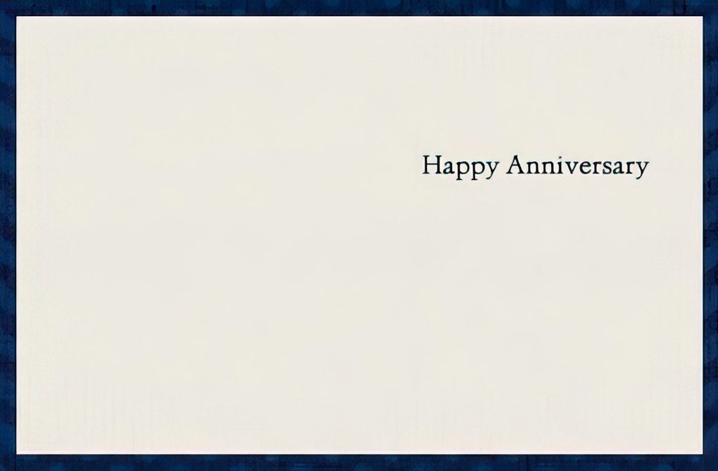 Inside of a simple, elegant anniversary card with the message 'Happy Anniversary' centered on a white background, framed by a dark blue border.