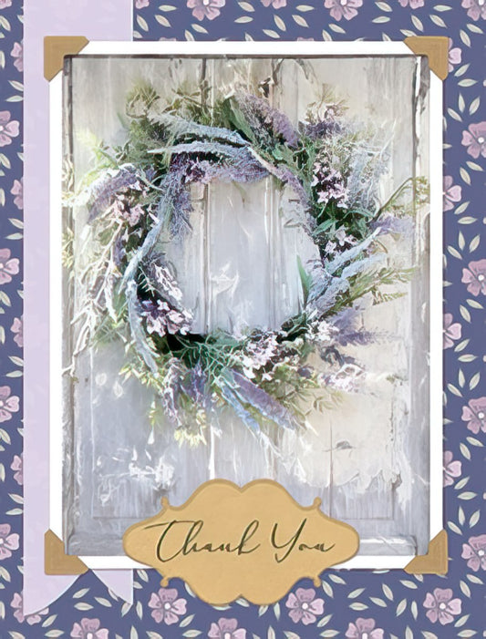 Front of a thank you greeting card featuring an elegant lavender wreath on a rustic wooden door, with 'Thank You' in gold script.