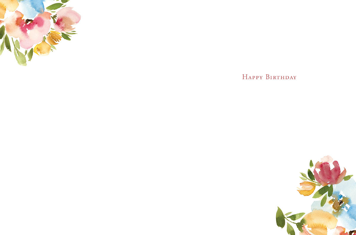 Inside of a watercolor floral note card with "Happy Birthday" and small floral accents in the corners.