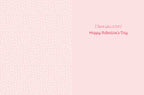 Inside of a cute greeting card with a light pink heart pattern background and the message 'I love you a ton! Happy Valentine's Day' in pink script font.