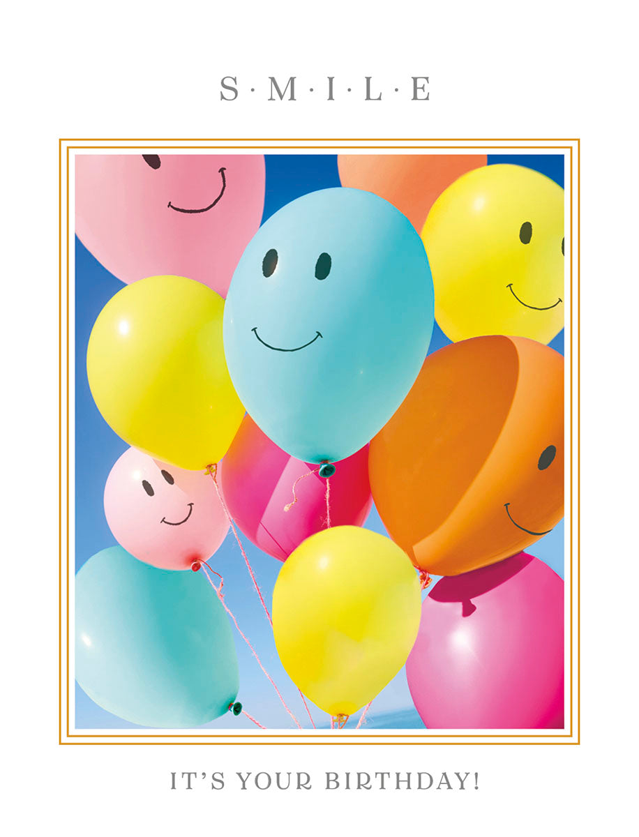 Vibrant greeting card with a gold border, featuring colorful smiling balloons against a blue sky, with 'S.M.I.L.E' at the top and 'IT'S YOUR BIRTHDAY!' at the bottom.