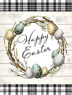 Watercolor Easter wreath greeting card front with speckled eggs, pussy willow branches, and 'Happy Easter' script on a white wood plank and black buffalo plaid background.