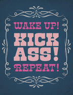 Front of a sassy birthday greeting card with a dark blue background and an ornate white frame. Bold pink text reads: WAKE UP! KICK ASS! REPEAT! for motivation.