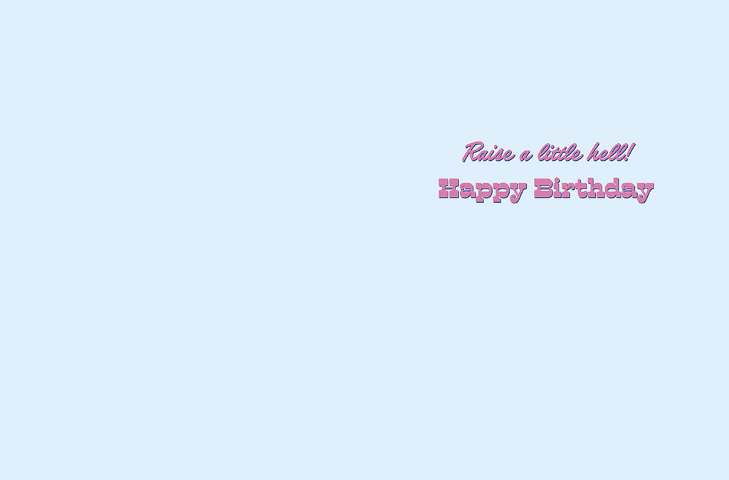 Inside view of a fun greeting card with a light blue background, revealing the bold purple text 'Raise a little hell! Happy Birthday' for a spirited celebration.