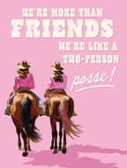 Greeting card featuring two cowgirls riding horses, viewed from behind, on a vibrant pink background. White text declares 'WE'RE MORE THAN FRIENDS WE'RE LIKE A TWO-PERSON POSSE!'. Perfect for a best pal or riding partner.