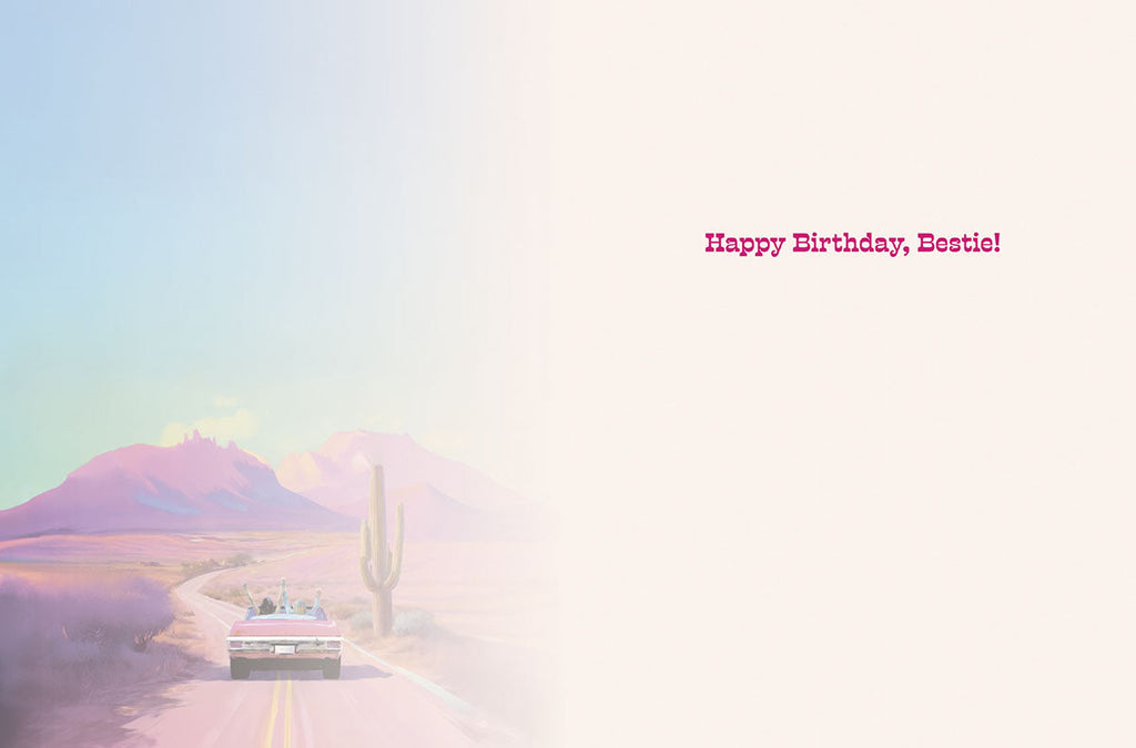 Open sassy birthday greeting card, showing the left side with a faded desert landscape and the right side with a white background and pink text 'Happy Birthday, Bestie!'.