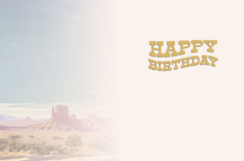 Inside of a thoughtful greeting card displaying 'HAPPY BIRTHDAY' in a matching golden wavy font on the right, with a subtle, faded desert landscape background on the left for a serene touch.