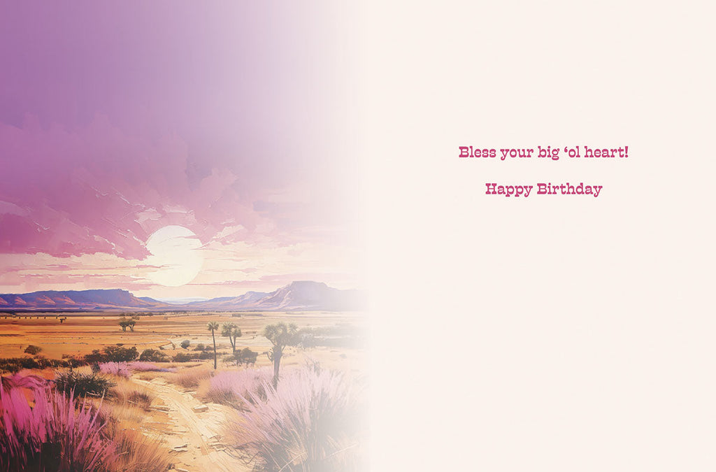 Open religious birthday card for a friend, showing a desert landscape continuation and the heartfelt message 'Bless your big 'ol heart! Happy Birthday' inside.