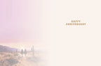 Inside of a romantic anniversary card with a subtle desert sunset background, showing faint distant riders, and the elegant text 'HAPPY ANNIVERSARY' with ample space for a personal message.